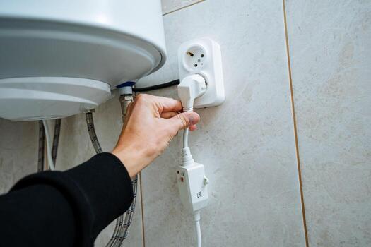 Effectively Hand Plugging In Electrical Appliance Vulnerable to Water Heater in a Bathroom Setting While Considering Safety Precautions and Proper Wiring Techniques for Optimal Functionality photo