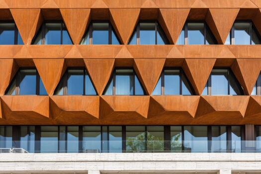 Architectural facade showcasing a striking burnt wood color with geometric patterns and large windows, creating a modern aesthetic in urban design with copy space photo