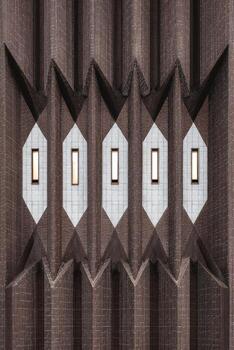 Architectural facade featuring burnt wood color with unique geometric patterns and contrasting textures, showcasing modern design elements and innovative construction techniques photo