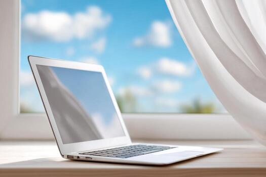 ordenador portátil en de madera mesa cerca abierto ventana con brillante cielo y nubes, creando un sereno espacio de trabajo atmósfera con natural ligero y atractivo ambiente foto
