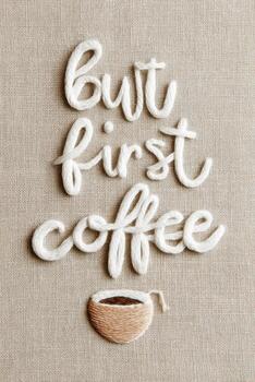 textual Arte pedazo presentando el frase pero primero café, hecho a mano con hilo en un texturizado tela fondo, creando un acogedor y atractivo atmósfera para café amantes foto