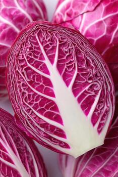 Halved red cabbage showcasing intricate textures and patterns, resembling a blueprint structure, with vibrant colors and natural details, ideal for culinary or design concepts photo