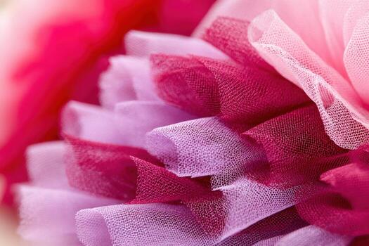 Macro texture of layered tulle fabric in shades of pink, showcasing delicate transparency and soft folds, ideal for fashion design and creative projects with copy space photo