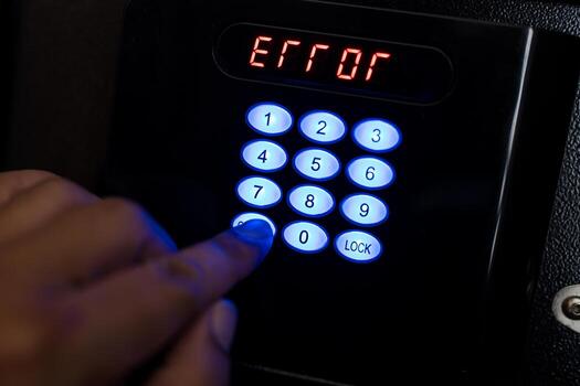Man trying to press passwords on safety lock pad for open a safety box and wrong a PIN code. photo