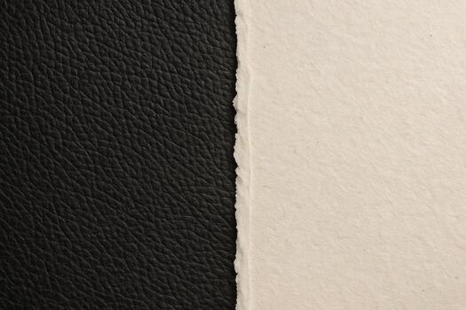 Black leather beside smooth beige material with a clean vertical split a minimal surface study for design backgrounds showing natural tones tactile texture and a calm visual mood for modern projects photo