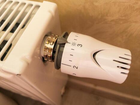 Thermostatic radiator valve setting for efficient heating. photo