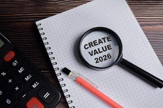 Concept of create value 2026 write on book with keywords isolated on Wooden Table. photo