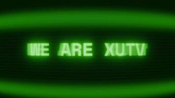 Old green CRT screen showing text WE ARE HERE appearing in random glitch and coding style video