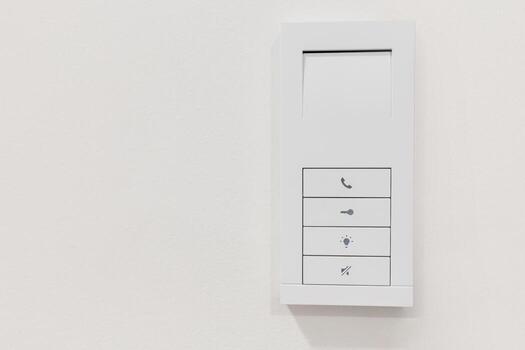 Smart home wall control panel for lights, locks, and intercom functions photo