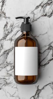 Amber bottle with white label on marbled surface, top-down photo