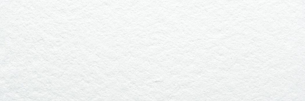 Close-up of textured white paper background with subtle patterns and soft lighting. photo