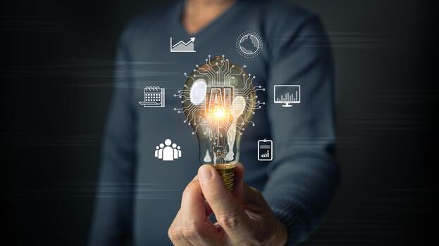 A man holds a glowing lightbulb embedded with AI circuits, surrounded by icons representing innovation, growth, data, teamwork, and progress, symbolizing the fusion of technology and creativity. photo