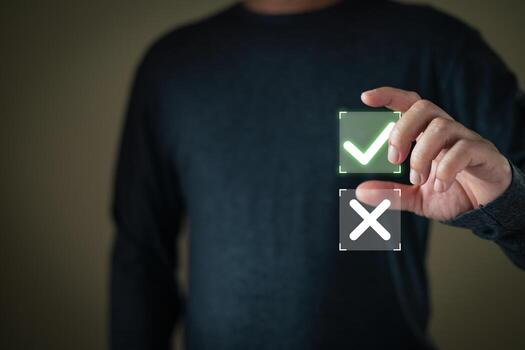 un persona selecciona un brillante verde marca de verificación desde un holográfico interfaz con un elección Entre un garrapata y un cruz, simbolizando decisión haciendo, aprobación, y confirmando el correcto opción. foto