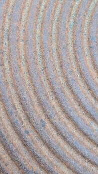 Abstract Patterns in Textured Surface with Circular Lines creating a visually intriguing design photo