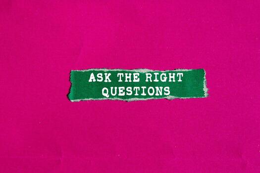 Ask The Right Questions message written on ripped torn green paper piece on pink background. Conceptual Ask The Right Questions symbol. Copy space. photo