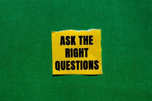 Ask The Right Questions message written on ripped torn yellow paper piece on green background. Conceptual Ask The Right Questions symbol. Copy space. photo