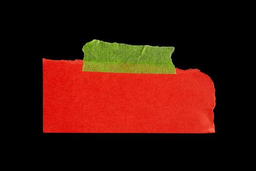 Torn red paper note with green adhesive tape, isolated scrap of textured sheet, ripped edges and sticky tape for collage, reminder or design element photo