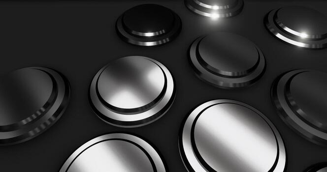 a group of silver and black buttons on a black background photo