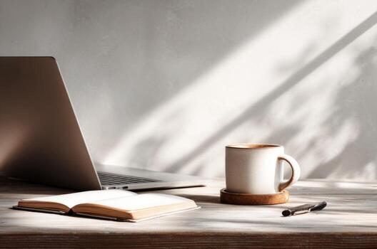 Remote work desk with laptop coffee and notebook photo