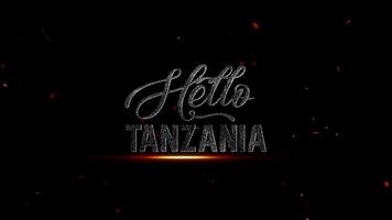 Olá Tanzânia uma cativante cinematográfico texto logotipo com fogosa brasas contra uma Preto fundo, ideal para viagem promoções e branding video
