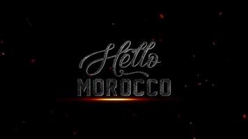 filmiska Hej marocko text animering en fängslande visuell resa med gnistrande partiklar och skimrande lampor i de natt video
