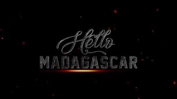 cinematográfico introdução título cartão Projeto com dinâmico texturizado 'olá Madagáscar' letras, iluminado de a etéreo brilho e faísca partículas, ideal para cativante abre e apresentações video