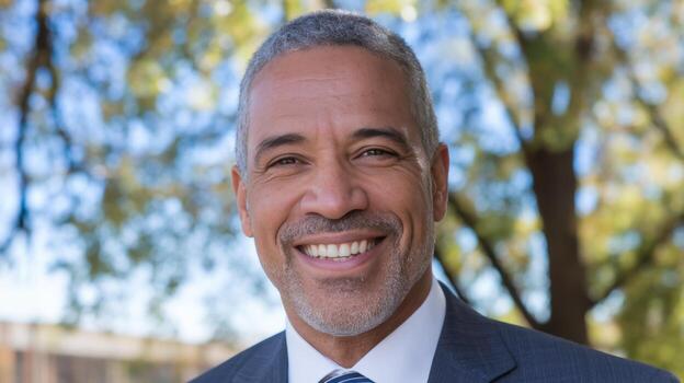 Smiling Man in a Suit Outside During Daytime, Portrait Shot photo