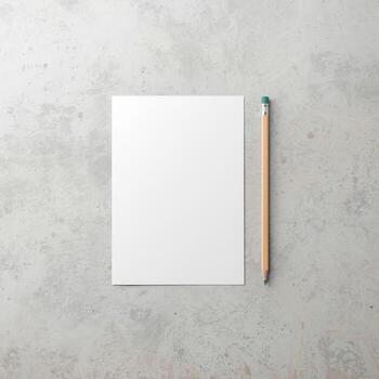 Minimalist blank paper and pencil composition on light gray surface photo
