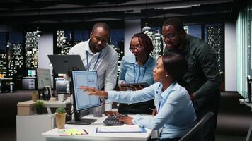 Black executive team analyzing online insights for resources allocation, demonstrating engagement and synergy between coworkers as they prepare performance reports. Networking. Camera A. video