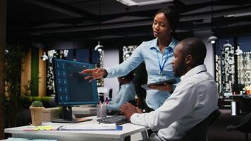 African american IT specialists using web AI assistant to automate text generation and solve daily tasks, enhance productivity. Integration of advanced algorithms and digital tools. Camera A. video