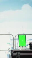 Vertical Vertical green screen tablet on drilling barge displaying maintenance dashboard, monitoring machinery. Mockup device on offshore platform deck digital analyzing performance metrics, panning shot video