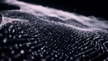 Futuristic data visualization of a flowing digital particle field. Luminous white dots form an elegant, undulating wave landscape on a dark background. video