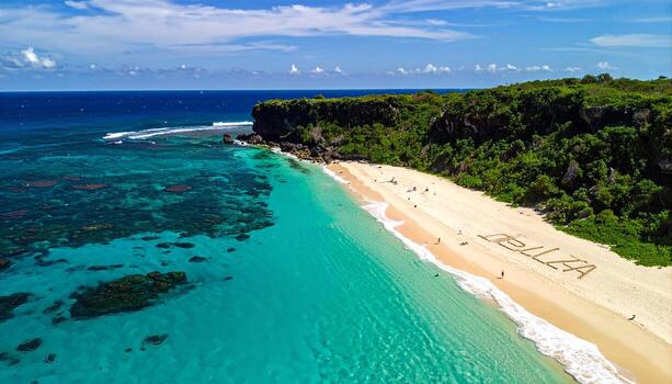 Aerial View of a Pristine Tropical Beach Paradise with Azure Waters Lush Green Cliffs and BELLA Written in the Sand photo