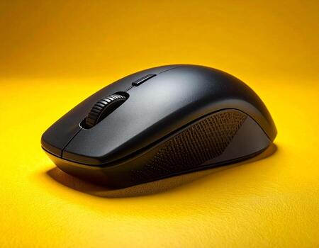 Wireless Mouse, Black Computer Mouse on Yellow Background, high angle view photo