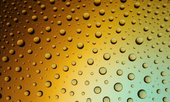 Macro view of numerous clear water droplets on a translucent surface with a vibrant gradient photo