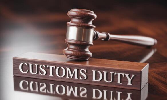 Polished wooden gavel resting on a block with CUSTOMS DUTY text, symbolizing trade law and taxation photo