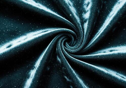 Luxurious dark teal crushed velvet fabric with sparkling glitter texture in a spiral pattern photo
