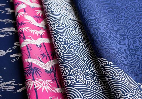 Three distinct japanese inspired silk brocade patterns featuring cranes, bamboo, waves, and swirls photo