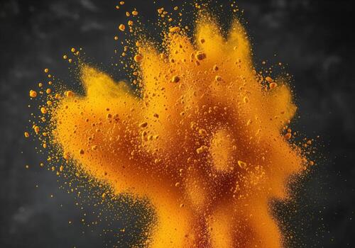 Vibrant golden yellow turmeric powder bursting dynamically, creating an energetic explosion photo