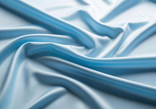 Undulating texture of draped light blue silk fabric with smooth folds and waves photo
