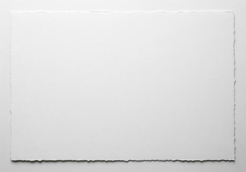 Clean unbleached white cotton rag paper sheet with natural deckled edges photo