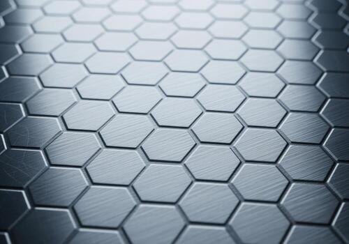 Brushed aluminum hexagonal grid pattern with metallic texture and light reflections photo