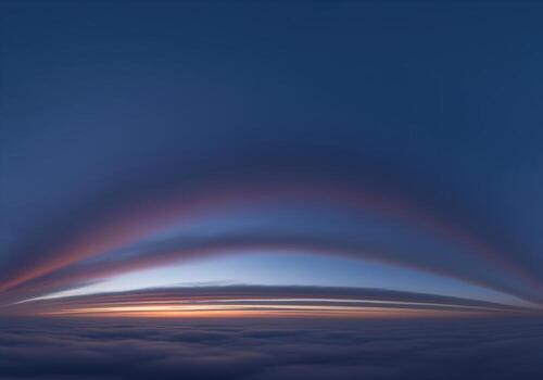 Stunning twilight cloudscape panorama with deep indigo sky and layered horizon light photo
