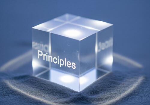 Principles etched on a glowing translucent cube representing core values photo