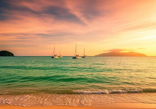 Golden hour tropical beach view with turquoise water and sailing yachts photo