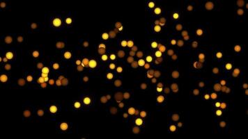 lysande gyllene klot flytande i mörker abstrakt bakgrund bokeh partiklar skimrande ljus effekter festlig video