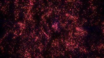 brilhando vermelho e laranja abstrato partícula campo formando uma vibrante cósmico fundo video