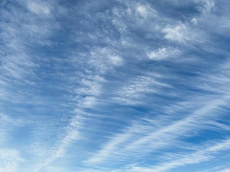 Strange clouds, blurred and drawn-out clouds over the city photo