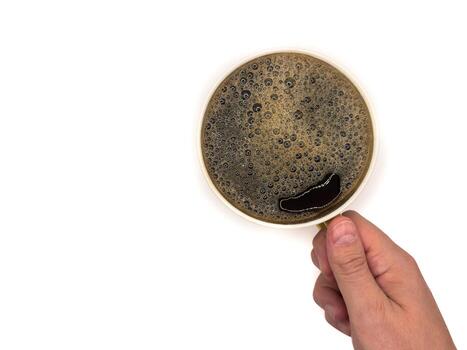 A cup of coffee. View from above. Isolated on white background. Flat lay. Top view copy space photo