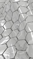 Metallic silver hexagonal geometric surface reflecting light with a modern abstract pattern video